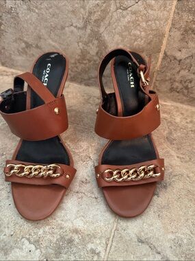 Woman’s coach sandals, high heel, gold chain,buckle, size 6.5 *flaw*